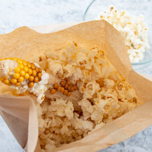 A look inside the popcorn bag after popping the ear of popcorn in the microwave. 
