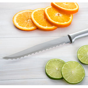 Serrated Slicer with silver handle next to sliced citrus fruits. 