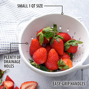 Small 1 QT size, plenty of drainage holes, easy grip handles. Colander full of strawberries next to a dishcloth.