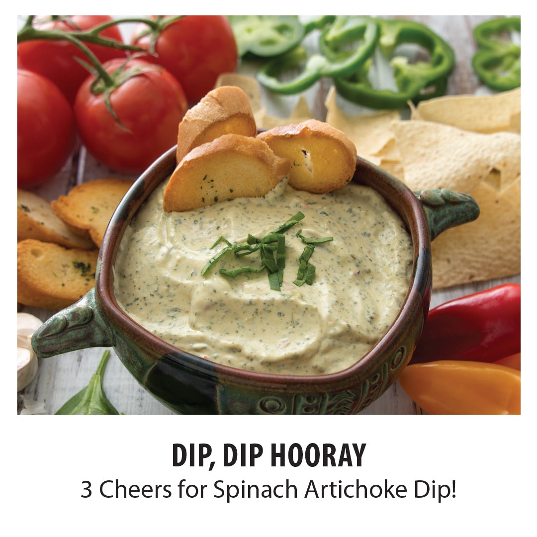 Spinach Artichoke Dip prepared with sour cream and cream cheese, served with crackers and veggies. 