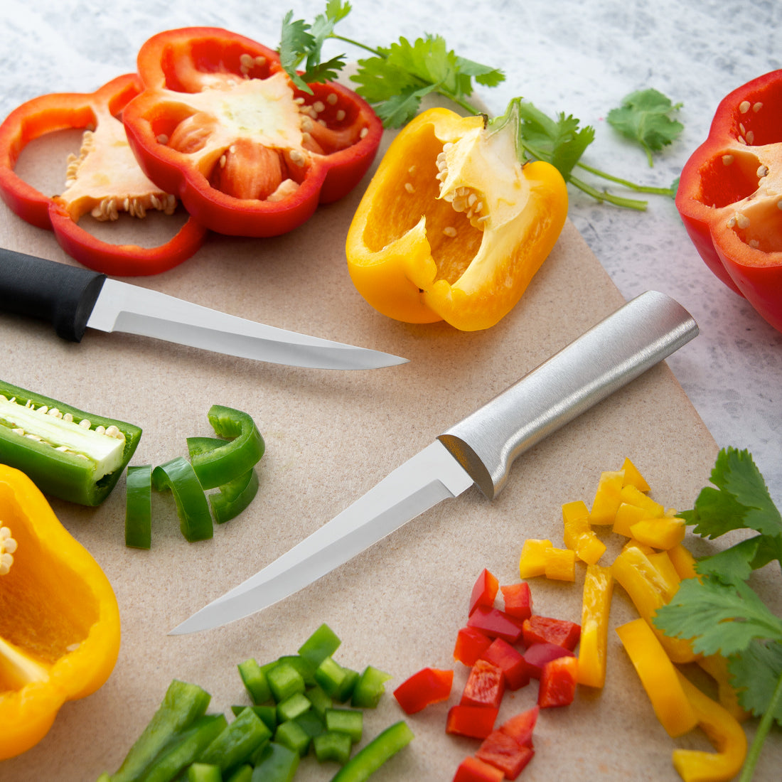 Two Rada Cutlery Super Parer knives with peppers. 