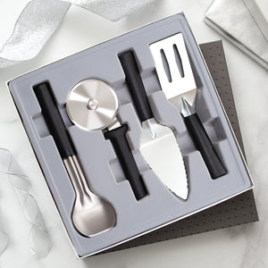 Four-piece Ultimate Utensil Gift Set with black handles in gift box. 